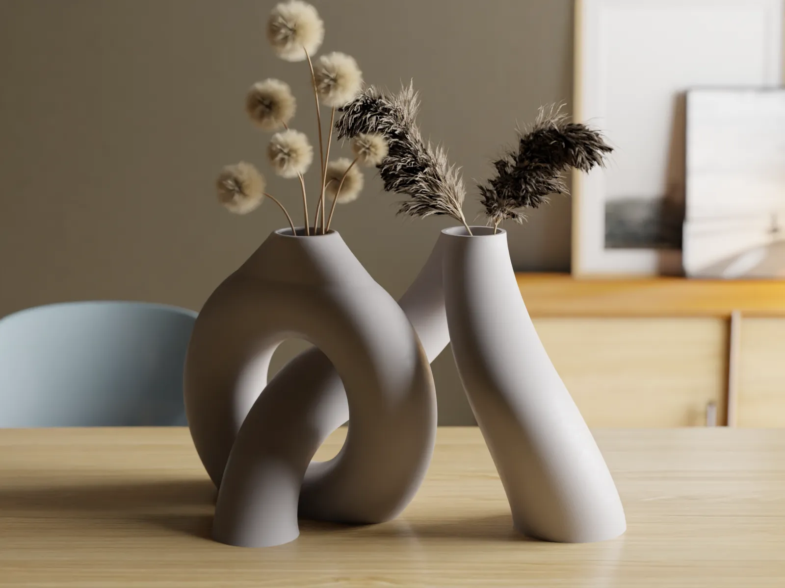 Interlocking Toroidal Vases in matte ceramic-look finish with dried stems